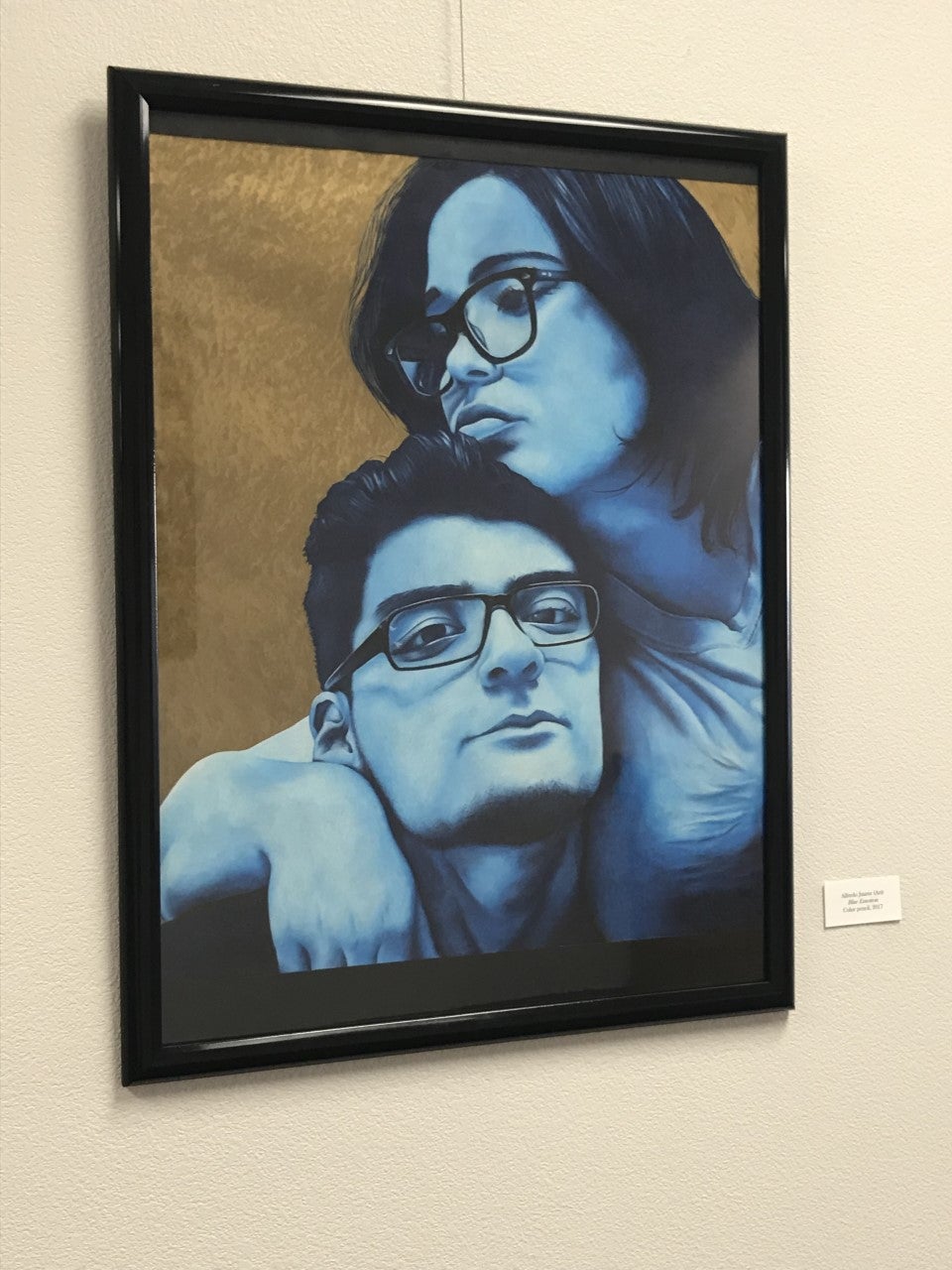 Painting of two people with glasses--one appearing masculine and one feminine--in blue