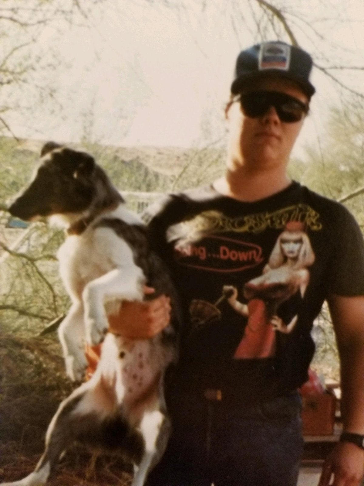 The author in younger, rowdier days Man holding dog