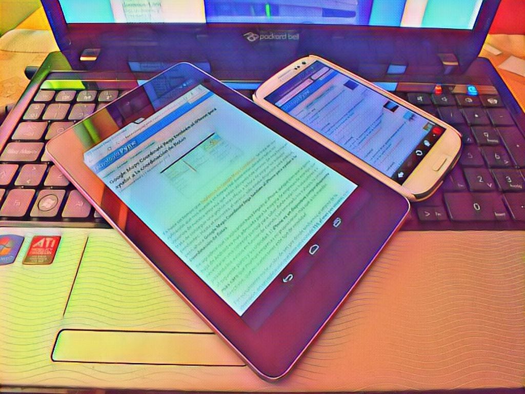 Colorful tablet and phone displayed on a laptop