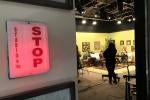 A red STOP light is on, indicating the studio in front is recording